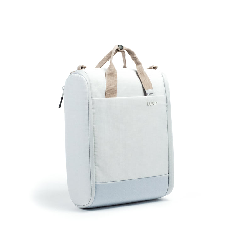 A light blue and white CPAP insert bag with beige handles, shown from a three-quarter angle on a white background.