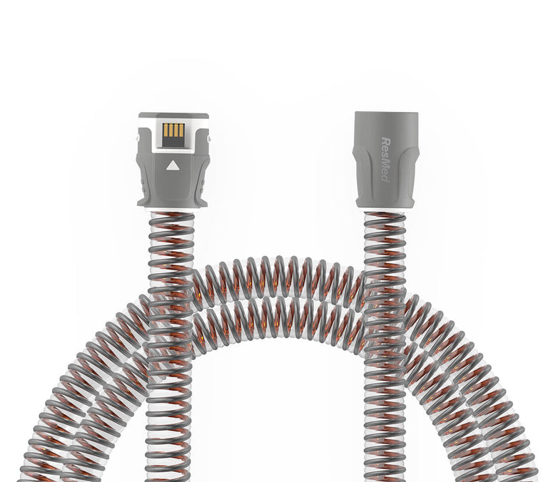 CPAP Tubing Climateline 11 on white background. The ends of the tubes are exposed.