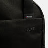 Close up of the black luxe backpack, zooming in on the resmed logo