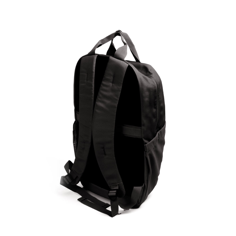 Resmed luxe bag, A black backpack shown from a rear three-quarter view, featuring padded shoulder straps, top carry handles, and side pockets, set against a plain white background.