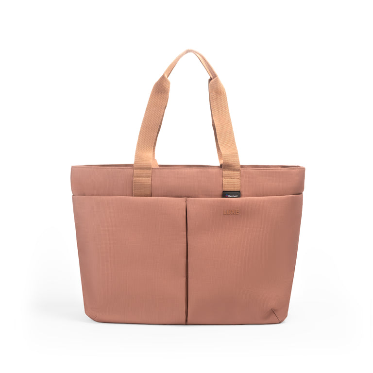 Luxe Tote bag A dusty rose tote bag with dual top handles and a front vertical seam, shown on a clean white background.