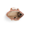 Luxe tote bag An overhead view of a dusty rose canvas tote bag showing its beige interior lining and top handles against a white background.