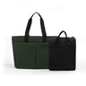 The green luxe tote bag and black CPAP insert: a larger dark green bag with black handles on the left and a smaller black bag with black handles on the right.