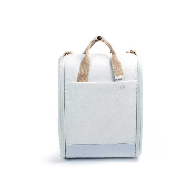 A white CPAP insert with beige fabric handles and a small 'LUXE' logo on the front, shown against a plain white background.